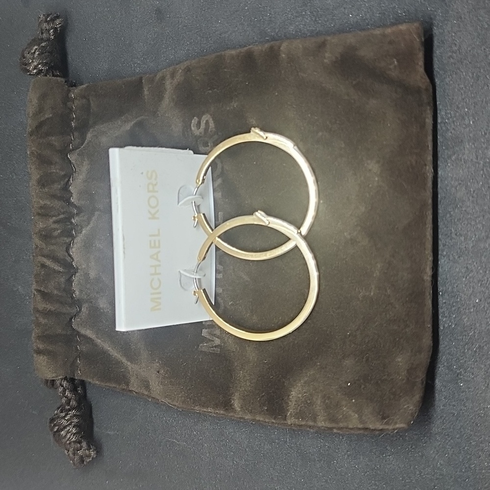 NWOT Michael Kors buckle white gold tone hoop earrings. Fabulous Summer Fashion!